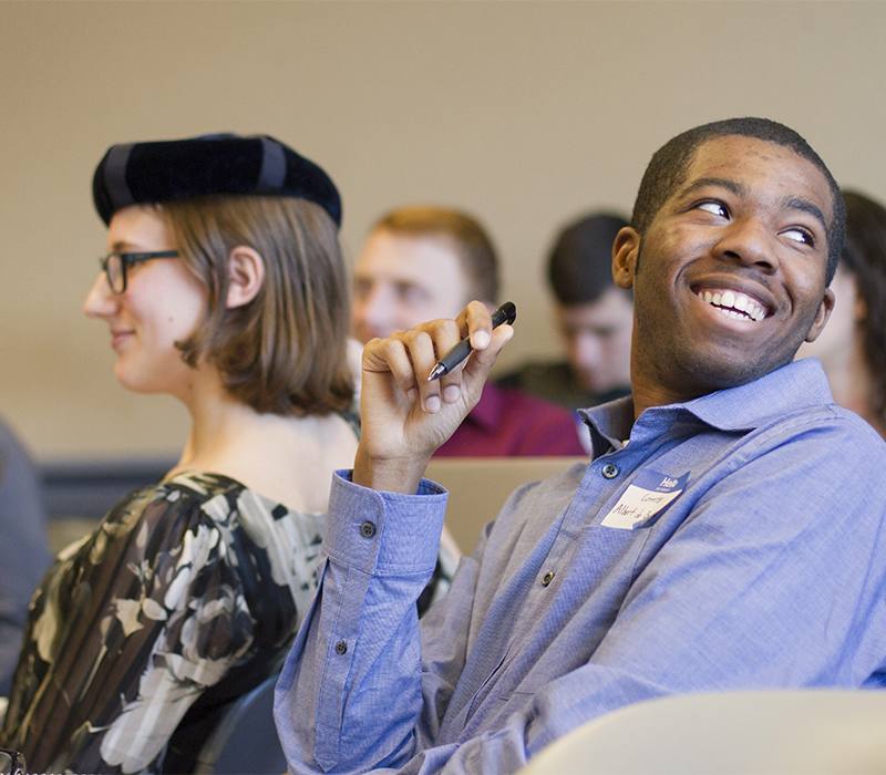 Students, including one in historical costume, in History's "Reacting to the Past" course.