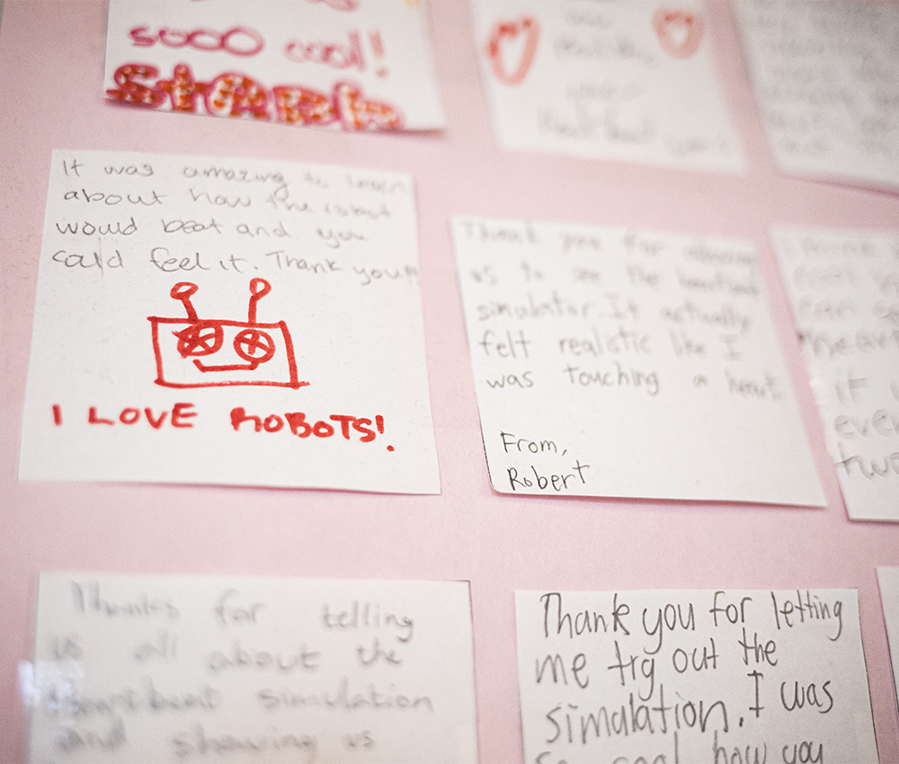 Post it notes with messages displayed during an in class discussion.