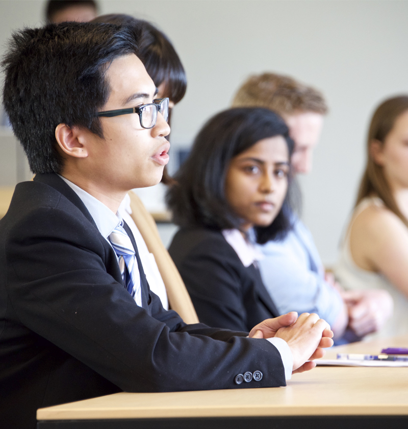 Student speaking in business conference room