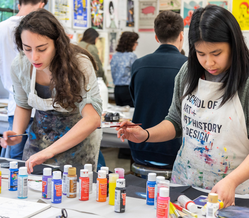 two students painting